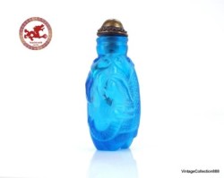 Antique Chinese Snuff Bottle Carved in blue Glass with Elephant,  base in the shape of elephant legs