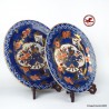 Juego de dos grandes platos decorativos vintage en porcelana china azul y dorada pintados a mano