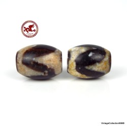 Two ancient,  very powerful and small Tibetan Dzi beads made of "Tiger Tooth" agate with very high energy