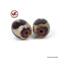 Two ancient,  very powerful and small Tibetan Dzi beads made of "Tiger Tooth" agate with very high energy