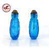 Antique Chinese Snuff Bottle Carved in blue Glass with Elephant,  base in the shape of elephant legs