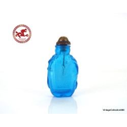 Antique Chinese Snuff Bottle Carved in blue Glass with Elephant,  base in the shape of elephant legs